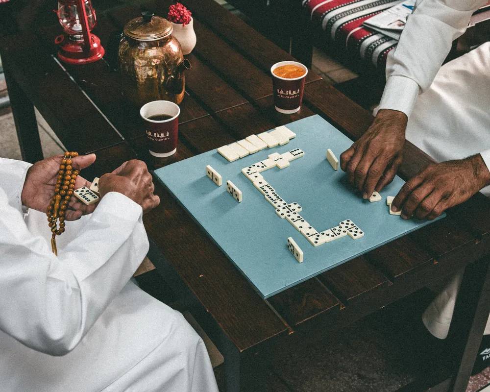 Dominoes and karak on the table